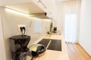 Kuchyň nebo kuchyňský kout v ubytování Pleasant Stay