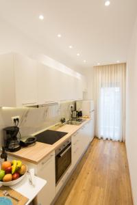Kuchyň nebo kuchyňský kout v ubytování Pleasant Stay