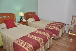 เตียงในห้องที่ Hotel Samaña
