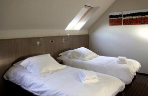 Ένα ή περισσότερα κρεβάτια σε δωμάτιο στο Hotel Otus