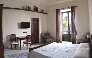 TV a/nebo společenská místnost v ubytování Agorà Panoramic Rooms