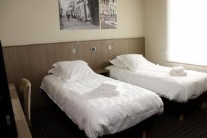 Ένα ή περισσότερα κρεβάτια σε δωμάτιο στο Hotel Otus