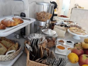 a table filled with lots of different types of food at Accanto a te - Charme Rooms in Vieste