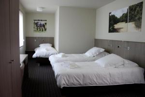 Ένα ή περισσότερα κρεβάτια σε δωμάτιο στο Hotel Otus