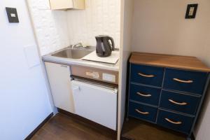 A kitchen or kitchenette at Dazaifu - Apartment / Vacation STAY 36942