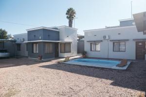 a house with a swimming pool in front of it at Rincon Secreto in San Rafael