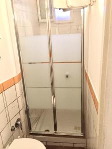 a shower stall in a bathroom with a toilet at Guest Apartment Monti in Rome