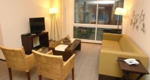 Et tv og/eller underholdning på Apartamentos en Agua Calma