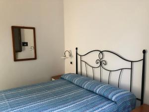 Postel nebo postele na pokoji v ubytování DAMMUSI JERIMAR