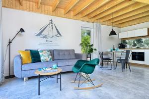 a living room with a couch and a table at SEI VENTI in Białogóra