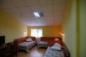 Postel nebo postele na pokoji v ubytování Hotel Nova