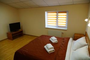 Postel nebo postele na pokoji v ubytování Hotel Nova