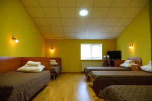 Postel nebo postele na pokoji v ubytování Hotel Nova
