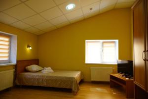 Postel nebo postele na pokoji v ubytování Hotel Nova