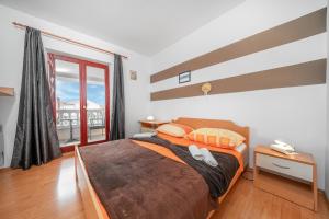 Posteľ alebo postele v izbe v ubytovaní Apartments Janjac