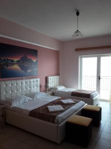 Postel nebo postele na pokoji v ubytování Hotel Odhisea Qeparo
