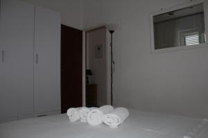 a group of rolled towels sitting on a bed at Petra Apartments in Korčula