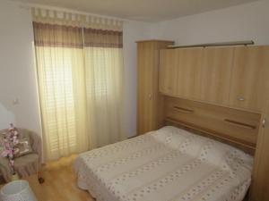 Postel nebo postele na pokoji v ubytování apartmani Mandic