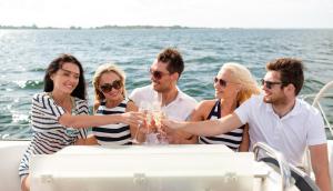 a group of people sitting at a table on a boat at AVANTI Lifestyle Hotel - Only Adults in Corralejo