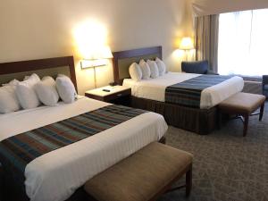 Kama o mga kama sa kuwarto sa Days Inn by Wyndham Natchez