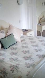 a bedroom with a bed with a pillow on it at Aydon House in Alnwick