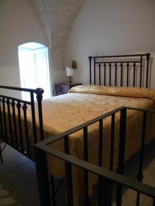 Ένα ή περισσότερα κρεβάτια σε δωμάτιο στο Palazzo Bitonti