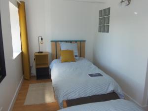 A bed or beds in a room at longère de kervéguen ARGOAT
