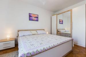 Postel nebo postele na pokoji v ubytování Nina Apartment