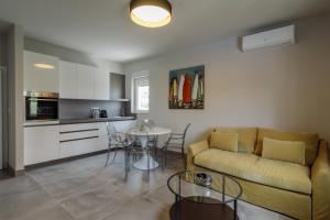 a living room with a couch and a table at Villa Gala in Trogir