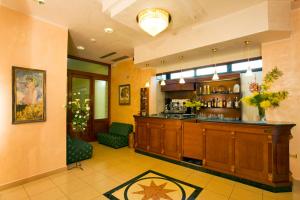 a lobby with a bar in a hotel room at HOTEL ANDREA'S in Rimini