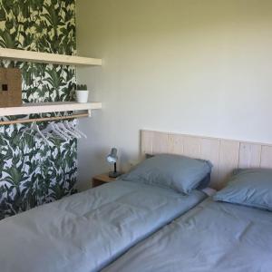 Een bed of bedden in een kamer bij Bungalow Groen