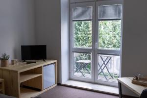 Μια τηλεόραση ή/και κέντρο ψυχαγωγίας στο Natura +9 φωτογραφίες