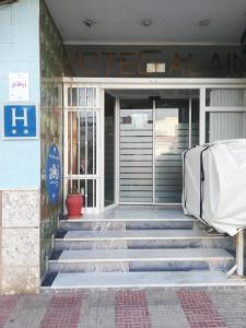 an entrance to a building with stairs in front at Hotel Alain in Silla