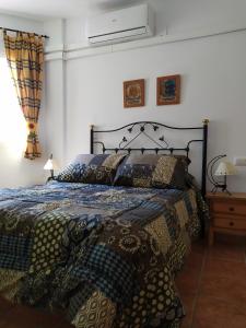 מיטה או מיטות בחדר ב-Alojamiento valeria