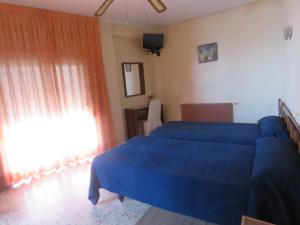Postel nebo postele na pokoji v ubytování Hotel Alain