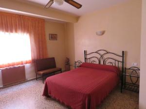 Postel nebo postele na pokoji v ubytování Hotel Alain