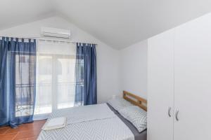 En eller flere senge i et værelse på House Paklenica Stone I