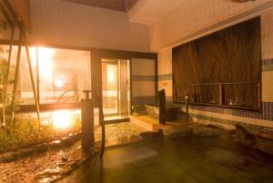 a room with a pool of water in a building at Dormy Inn Premium Kyoto Ekimae Natural Hot Spring in Kyoto