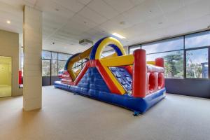a room with a inflatable slide in a building at North Pier Hotel in Cowes