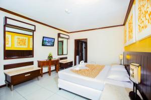 Postel nebo postele na pokoji v ubytování Bali Garden Beach Resort