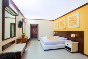 Postel nebo postele na pokoji v ubytování Bali Garden Beach Resort