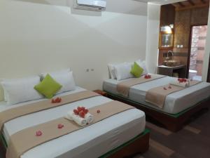 Ένα ή περισσότερα κρεβάτια σε δωμάτιο στο Balenta Bungalow Gili Trawangan