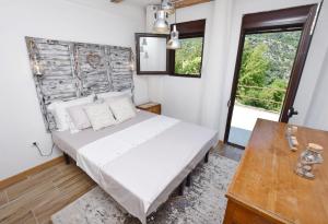 מיטה או מיטות בחדר ב-Rooms Sveti Toma