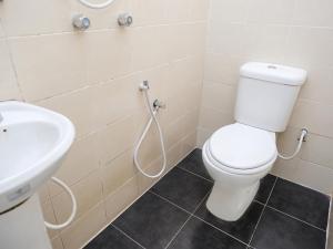 a bathroom with a toilet and a sink at Ridel Boutique Hotel in Wakaf Che Yeh