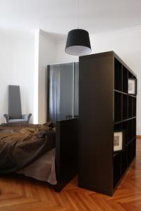 Łóżko lub łóżka w pokoju w obiekcie Valsabbion City Suite