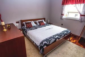 Postel nebo postele na pokoji v ubytování Apartments Saric
