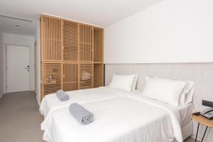 Posteľ alebo postele v izbe v ubytovaní Enorme Ammos Beach Resort