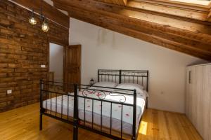 a bedroom with a bed in a room with wooden ceilings at LUXURY VILLA HEAVEN nr. 2 in Donji Muć +97 photos