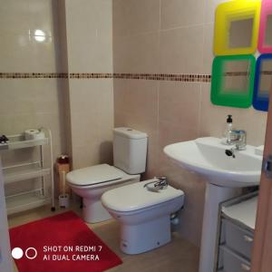 a bathroom with a toilet and a sink at Apartment Verge de Montserrat in Cambrils