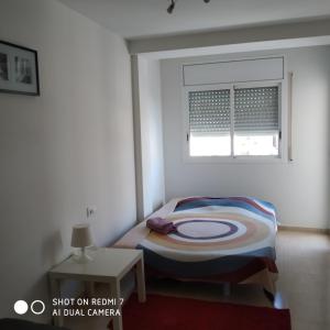 En eller flere senger på et rom på Apartment Verge de Montserrat